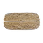 Rectangular brown compressed material with a textured surface photographed on a plain background.